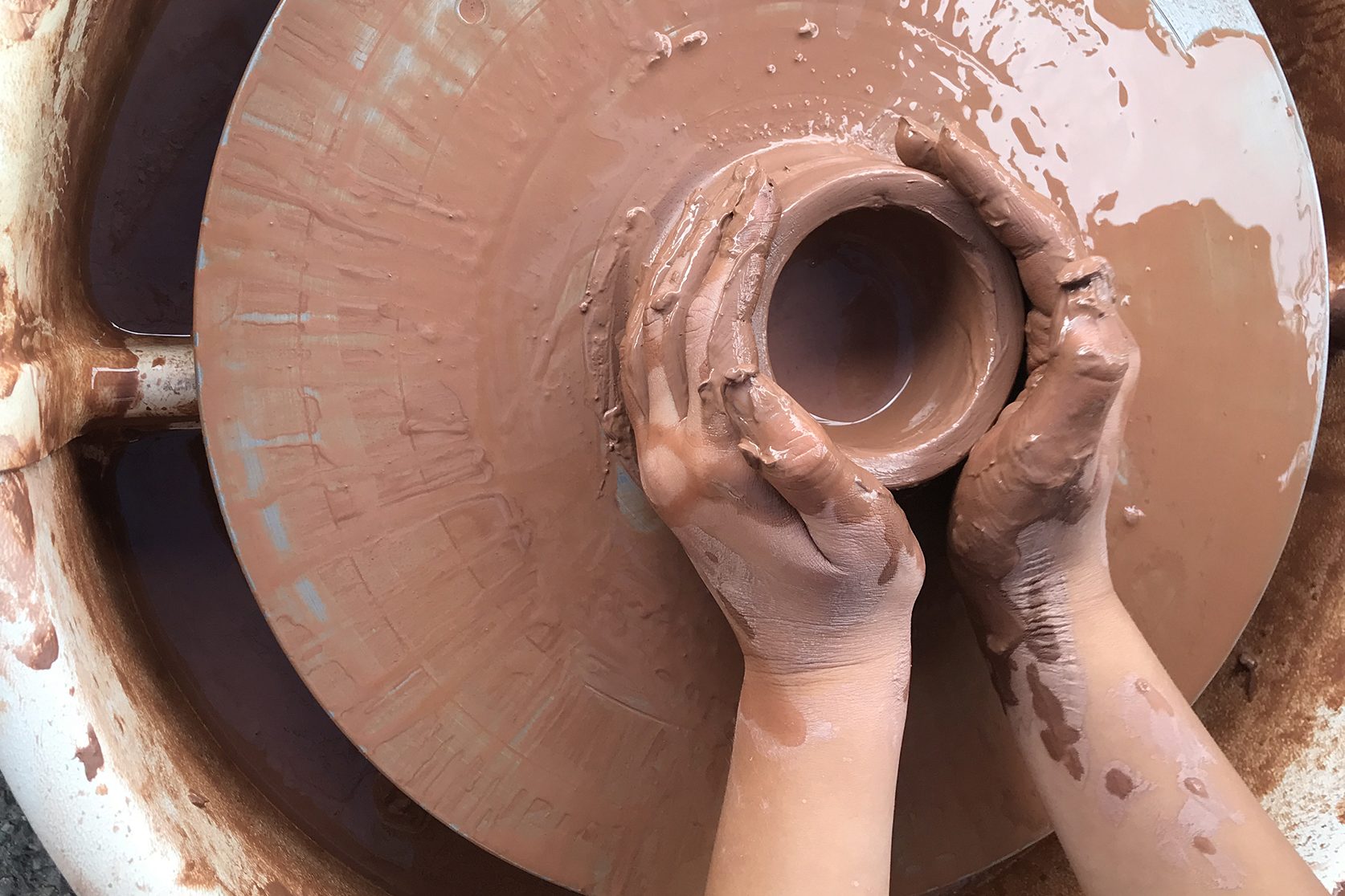 clay pot being made on wheel