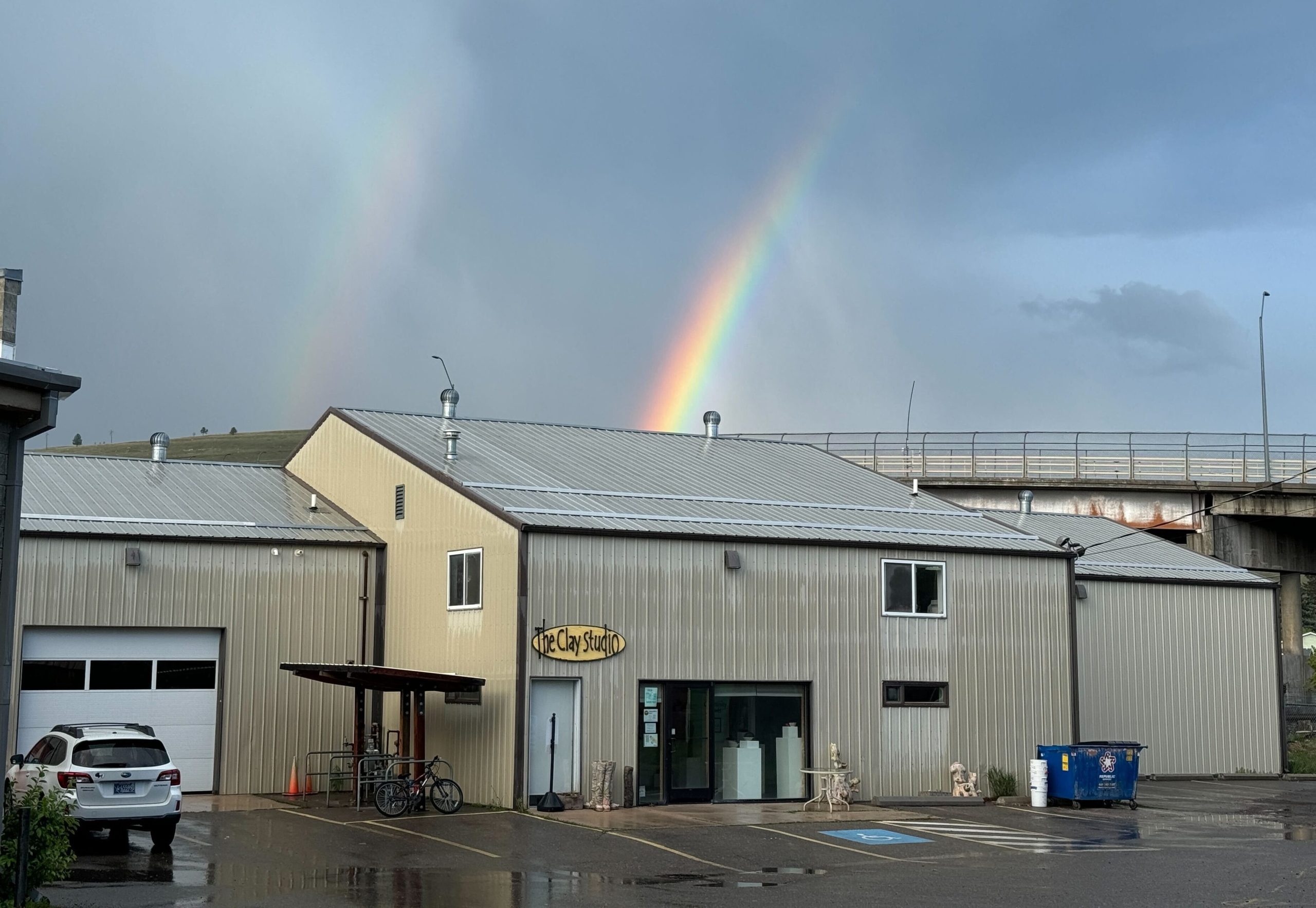 Clay Studio of Missoula building with rainbow in background