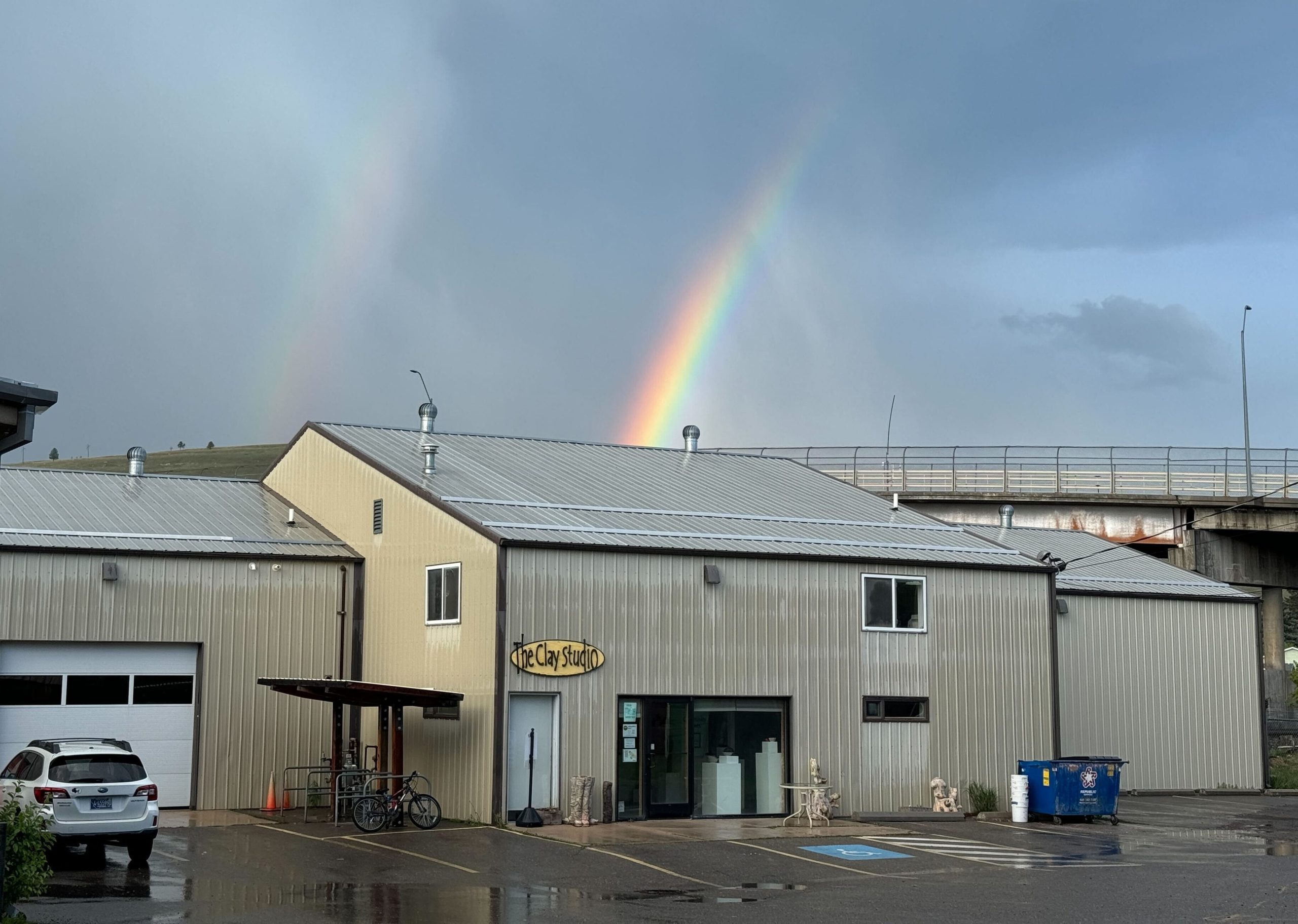 Clay Studio of Missoula building with rainbow in background