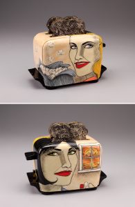 Ceramic sculpture of a toaster with illustration